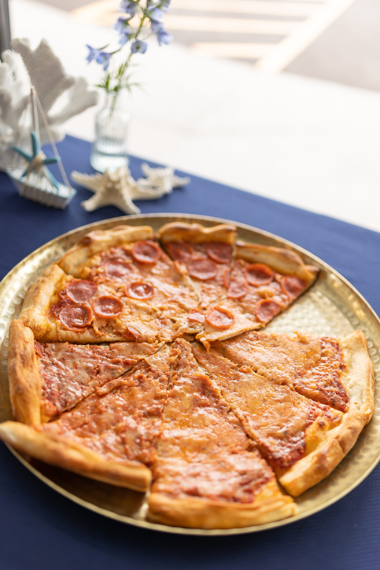 Pepperoni pizza on a gold tray at a birthday celebration