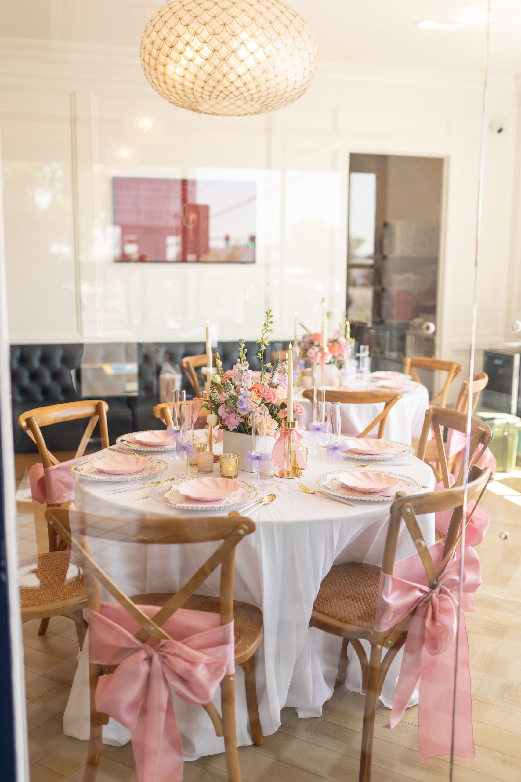 Elegant floral table setting with pink sashes and curated décor at The Little Play Avenue